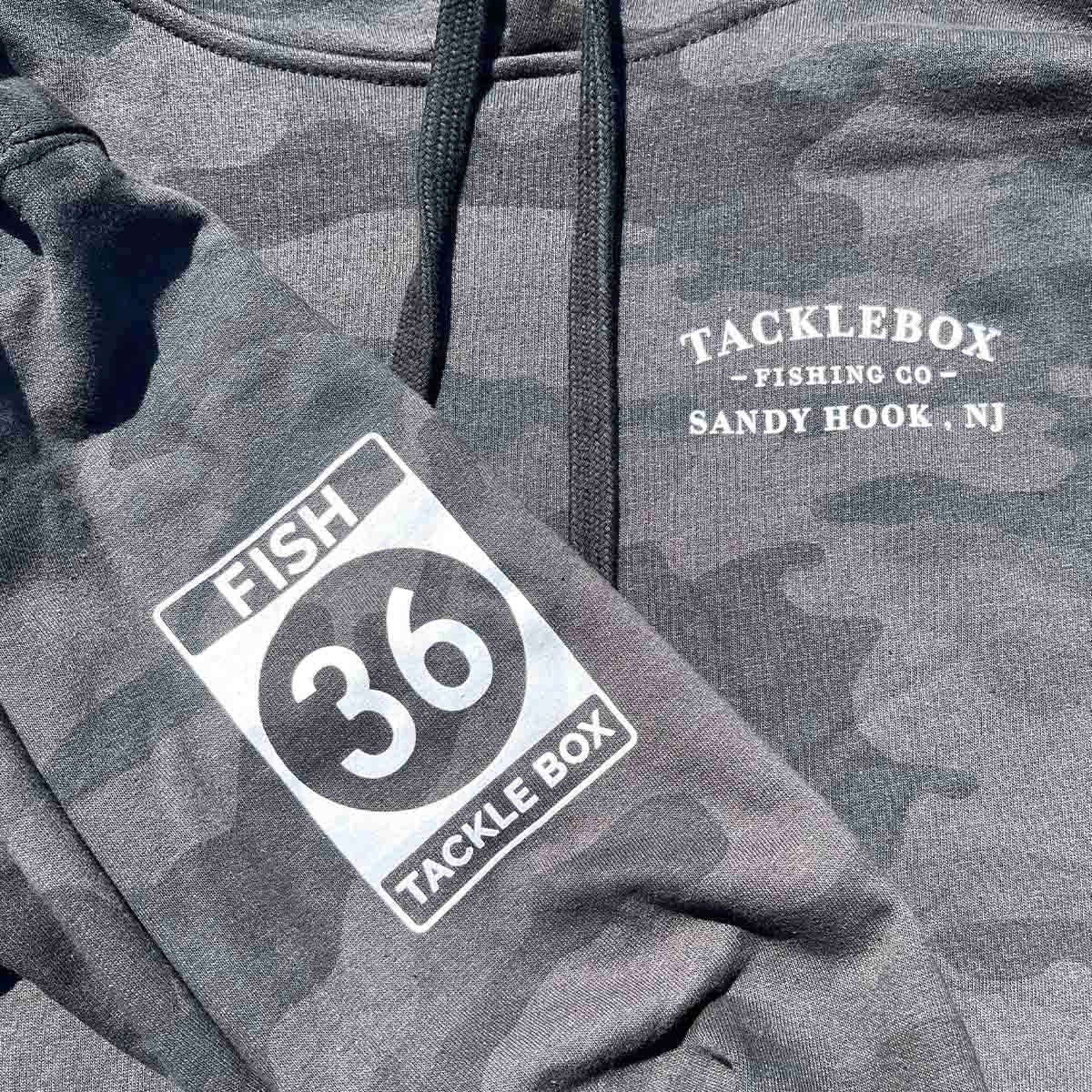 https://www.tackleboxnewjersey.com/cdn/shop/products/camohoodiedetailed.jpg?v=1664370273&width=1946